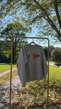 Fall embroidered sweatshirt hanging outdoors