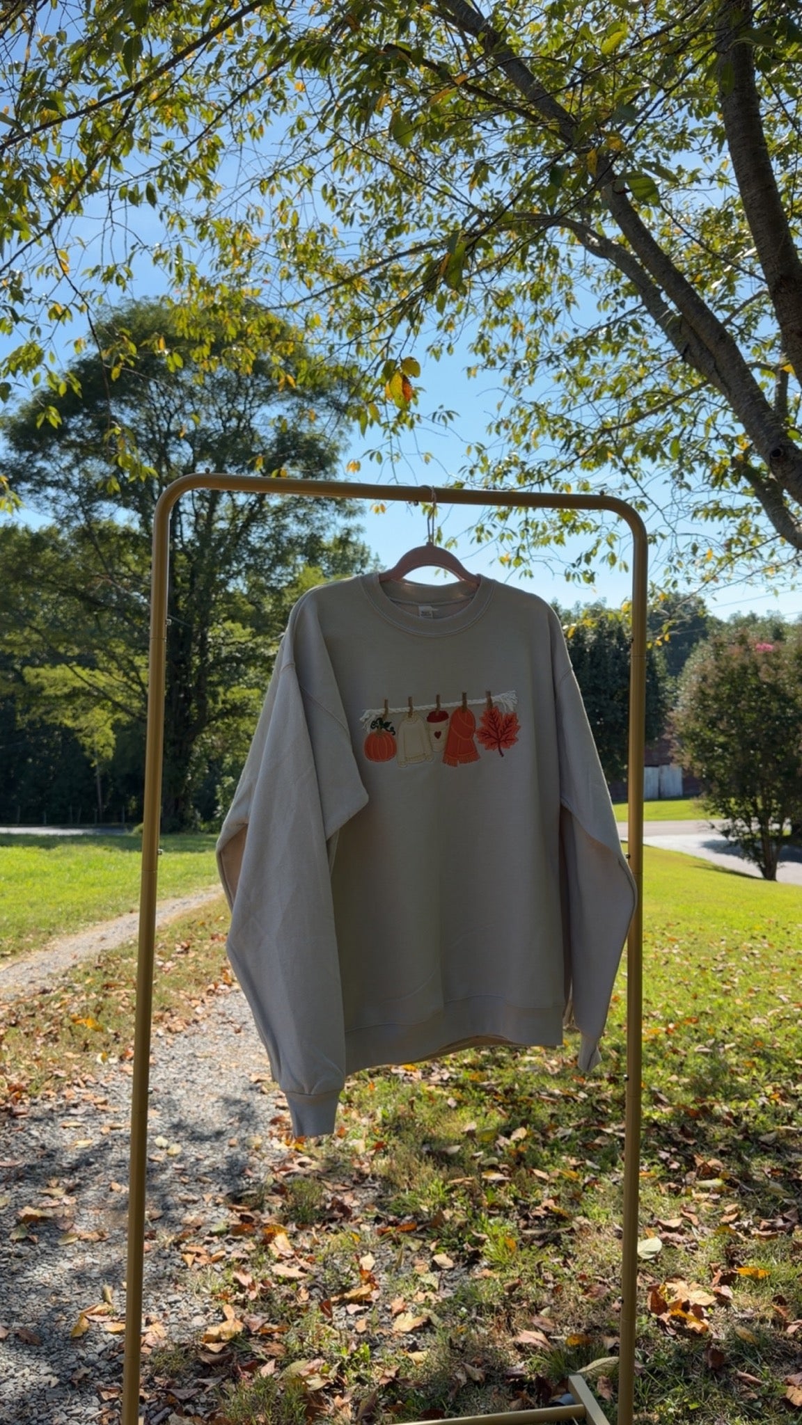 Fall embroidered sweatshirt hanging outdoors